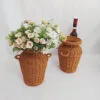 Geflochtene Rattanvase im Boho-Stil Geflochtene Rattanvase im Boho-Stil