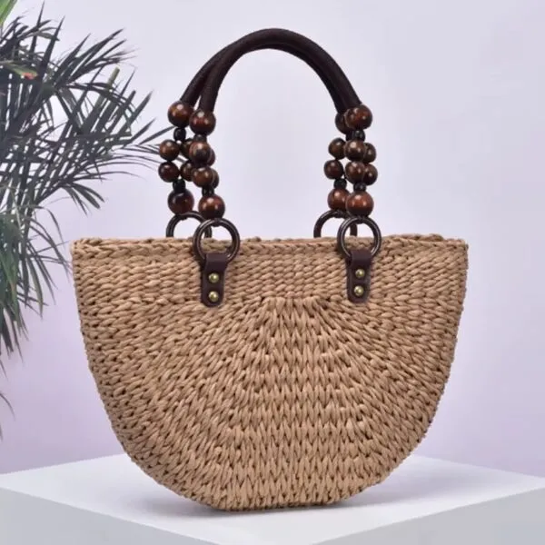 Rattan-Tasche mit Holzperlen Rattan-Tasche mit Holzperlen