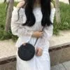 Runde Boho-Handtasche aus handgeflochtenem Rattan Runde Boho-Handtasche aus handgeflochtenem Rattan