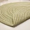 Runder Rattan-Teppich in Grün Runder Rattan-Teppich in Grün