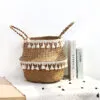 Übertopf aus Rattan mit Spitzenmuster im Nordik-Stil Übertopf aus Rattan mit Spitzenmuster im Nordik-Stil