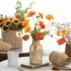 Vase aus Glas und Rattan Vase aus Glas und Rattan