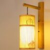Wandlampe aus Rattan mit zylindrischem Design und asiatischen Mustern