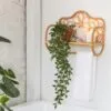 Wandregal aus Rattan in Bankform Wandregal aus Rattan in Bankform