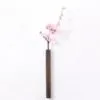 Wandvase aus dunklem Holz Wandvase aus dunklem Holz