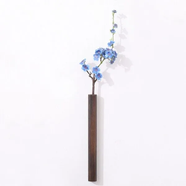 Wandvase aus dunklem Holz Wandvase aus dunklem Holz