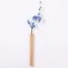 Wandvase aus hellem Holz Wandvase aus hellem Holz